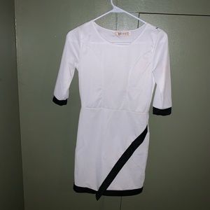 Black and white, form fitting mini dress. Size 4.